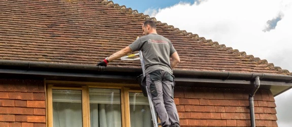 our team cleaning the gutters on a house in Stoke Bishop, Lancashire